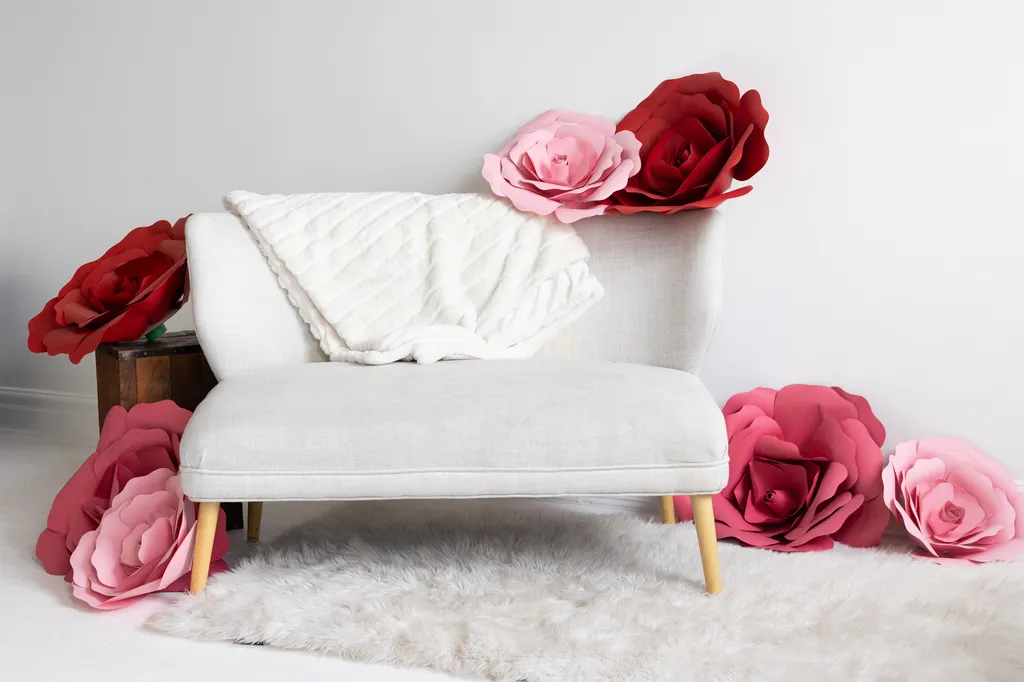 white couch against white wall in studio