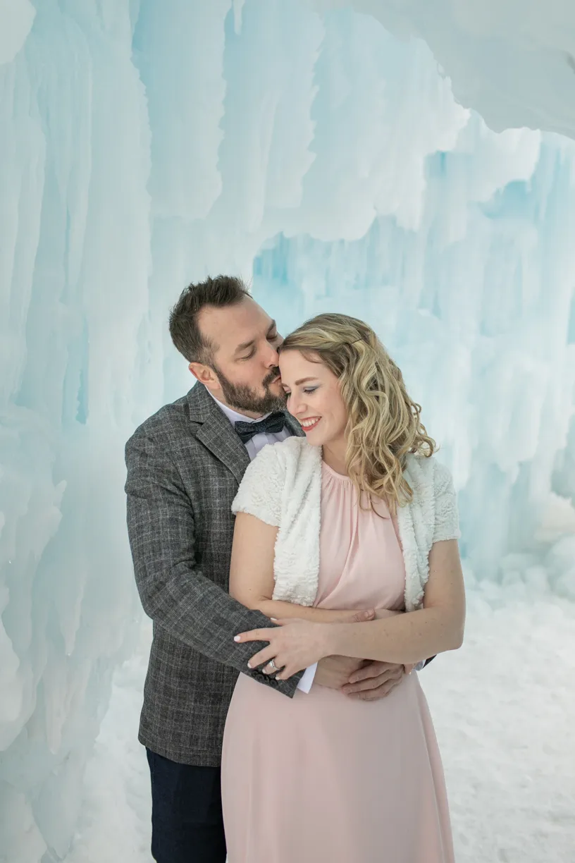 couple snuggling up at the ice castles in excelsior