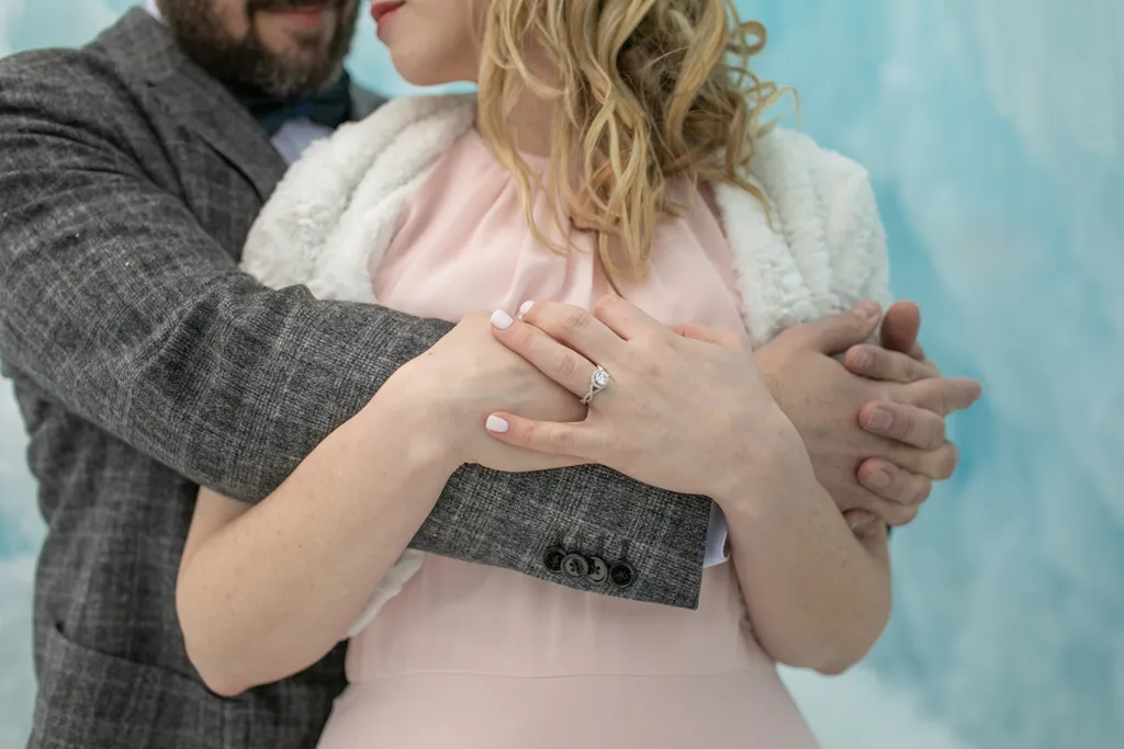 close up of arms and hands, ice castle engagement