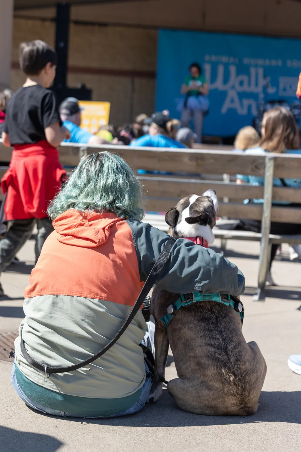 woman and dog at walk for animals